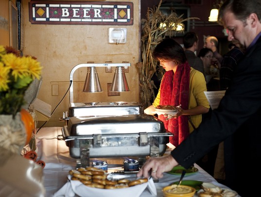 Ann Arbor resident Lisaurel Winfree samples food from the buffet at the Book Industry Charitable Foundation fundraiser event on Saturday. The theme of the event was zombie apocalypse. Daniel Brenner I AnnArbor.com